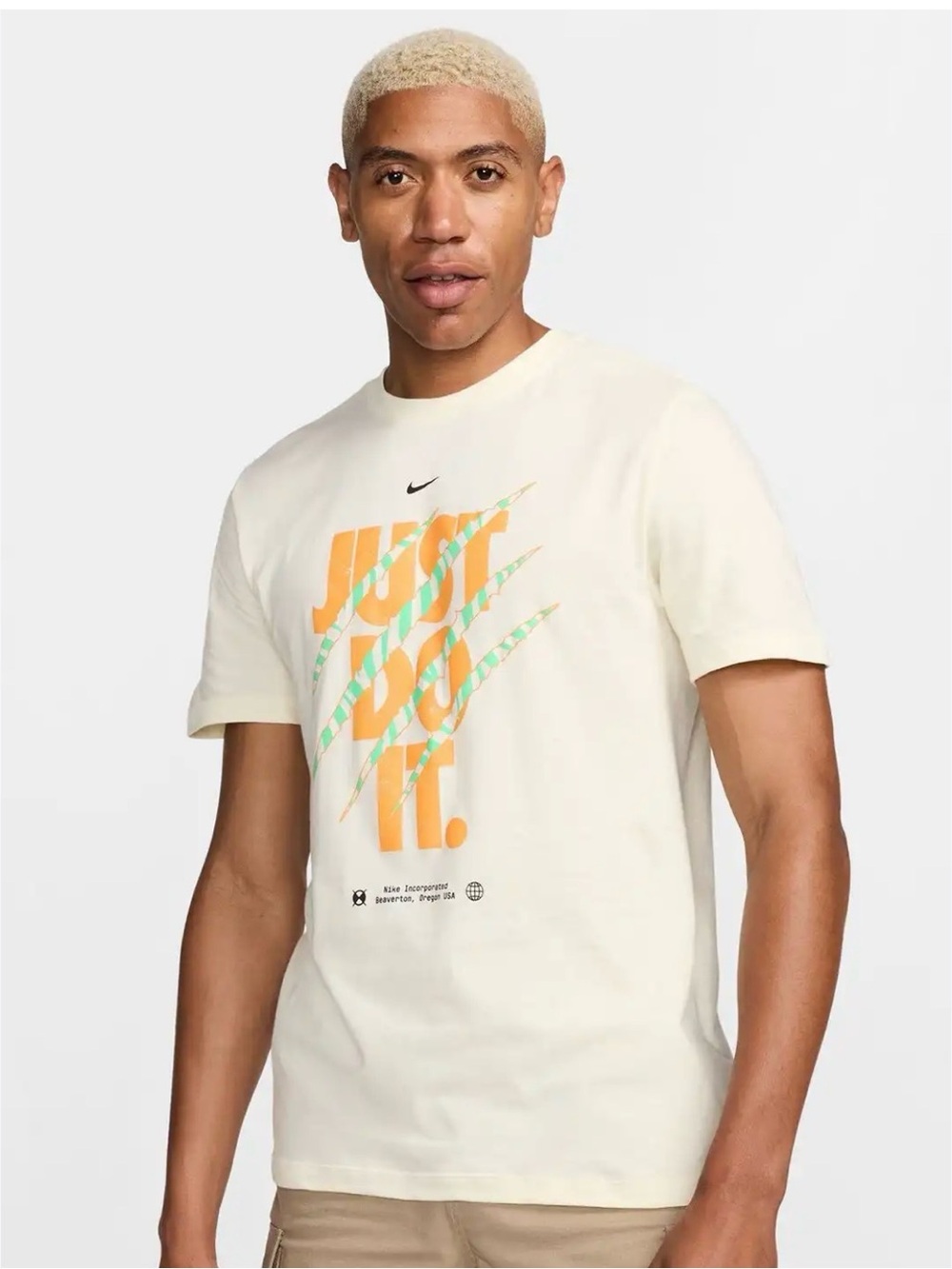 Nike NWT cream tee with small stain size medium